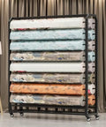 Heavy Duty Rolling Fabric Roll Storage Rack With Adjustable Steel Crossbars Commercial Textile Dispenser for various rolls.