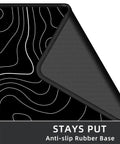 Close-up of Extra Large Gaming Mouse Pad With Black Topographic Print XXL Desk Mat showing anti-slip rubber base.