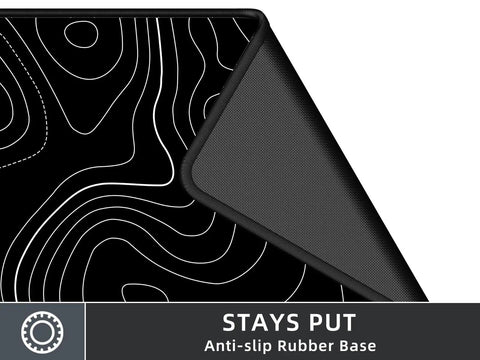 Close-up of Extra Large Gaming Mouse Pad With Black Topographic Print XXL Desk Mat showing anti-slip rubber base.