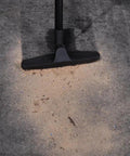 Upright and Canister Vacuum Extension Hose and Attachment Kit cleaning debris from carpet