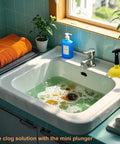Compact Mini Sink Drain Plunger With Short Handle And Heavy Duty Rubber Cup in a bathroom sink clearing clogs with bubbles.