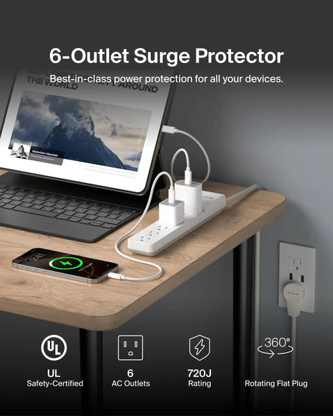 Six Outlet Slim Power Strip Surge Protector With Six Foot Cord And Rotating Plug 700 Joules Space Saving White in use on desk