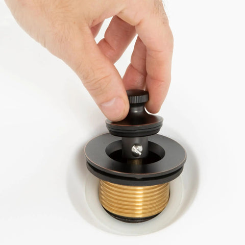 Hand installing Lift And Turn Brass Bathtub Drain Stopper Kit For Quick Tap Shutoff No Fuss Universal Fit for 1 3/8 or 1 1/2 inch drains