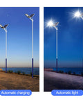JUDYSSY Outdoor Solar Powered Street Flood Lights-400W Dusk to N Solar Security Led Lamp with Remote Control in evening setting by the water.