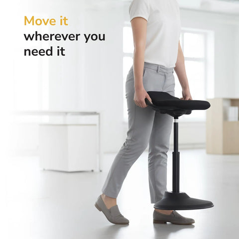 Person moving Comfy Ergonomic Sit Stand Stool For Standing Desk With Height Adjustment And 360 Degree Tilt Active Sitting Leaning Chair