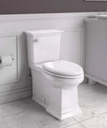 Heavy Duty Two Piece Elongated Toilet Featuring Reliable Powerwash Rim And Comfort Height Design For No Fuss Daily Refresh In Pristine White Porcelain in modern bathroom setting.