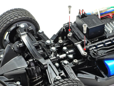 Close-up of RC car steering system with TT02 3x18mm Low Friction Step Screws Two Piece Upgrade enhancing performance.