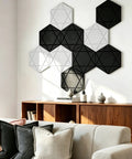 Kick The Echo To The Curb With Hexagon Acoustic Panels 12 Pack on a wall, featuring black and white designs, enhancing room acoustics.