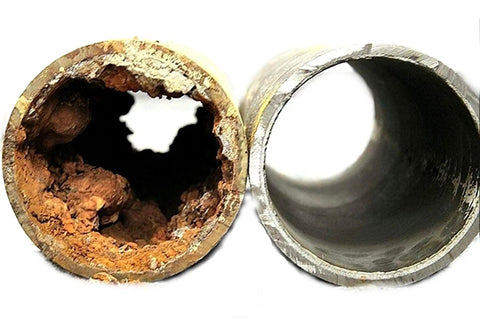 Comparison of two pipes, one clogged with mineral buildup, the other clean, illustrating Salt Free Magnetic Water Conditioner And Softener For Hard Water Descaler, Easy Install For Homes, Condos, And Apartments, Eco Friendly, Keeps Minerals In Suspension, Slashes Scale Build Up, No Salt Or Chemicals effectiveness.