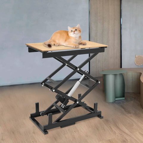 Built Tough Electric Scissor Lift Table Hauls 140 Lbs And Rises From 10 To 50 Inches Like Butter, with a cat on top, in a modern room.