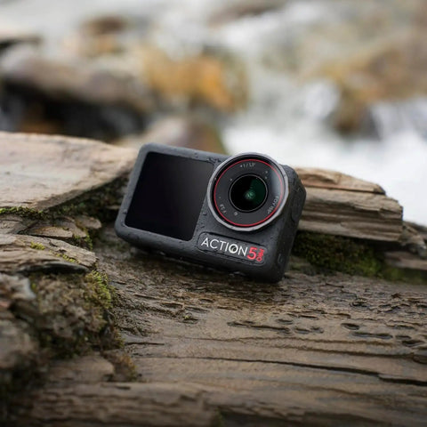 Rock Solid Waterproof Action Camera Bundle Shoots Clean 4K With Large Sensor on wet log in nature.