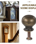 Stylish European Retro Clock Door Knobs In Antique Bronze Tone With Screws Perfect For Vintage Cabinet Hardware And Repair Projects That Give Your Space Serious Old World Charm And Sophistication. antique bronze round cabinet knob with screw, shown with vintage clock cabinet scenes