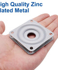 Smooth As Butter 3 Pack 2 Inch Lazy Susan Turntable Heavy Duty Silver Zinc Alloy Rotating Tray in hand, showing high-quality metal design.