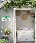 Funny Aluminum Safety Sign Wear Your Gear 8x12 Inch Wall Decor on shed exterior, surrounded by greenery.