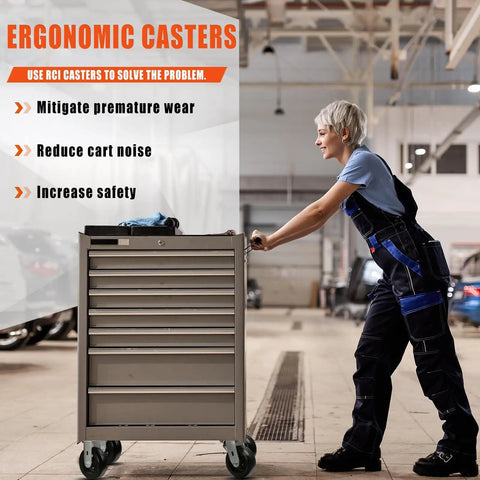 Person pushing a tool cabinet on caster wheels in a garage setting, highlighting ergonomic heavy-duty casters.
