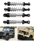 Adjustable Oil Shock Absorbers For 1/18 1/16 RC Crawlers, 4 Piece Metal Black Shocks Upgrade Kit with two toy trucks.