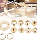 Badass Brass Router Guide Kit With 11 Piece Template Bushing Set For Precision Woodworking, featuring brass bushings on a workspace.