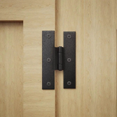 3.5 Inch Black Wrought Iron H Hinge With 1/4 Inch Offset For Kitchen Cabinets installed on light wood surface