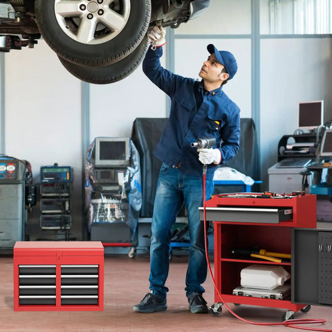 Mechanic working with Rolling Tool Chest With Five Drawers, Lockable Wheels, Sliding Drawers, Detachable Top, And Adjustable Shelf in garage