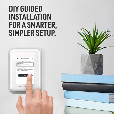 WiFi Smart Thermostat With Touchscreen Display shown during DIY installation guide, adjacent to books and plant