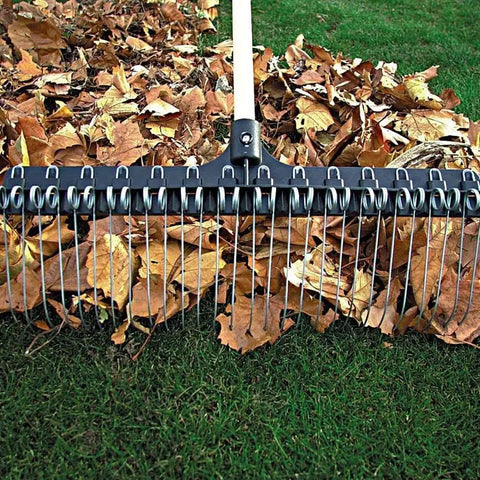 Heavy-Duty 55-Inch Fiberglass Rake With A 21-Inch Steel Tined Head For De-Thatching And Landscaping on lawn with leaves