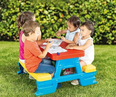 Big Plastic Picnic Table For Four Kids For Indoor And Outdoor Use Colorful Four Seat Table With 44 Pound Capacity and kids playing outside