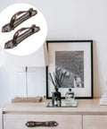 Two Pack Antique Zinc Alloy Door Handles Thickened 138mm Vintage Style Pulls For Wooden Doors And Cabinet Use With Old School Rustic Hardware For Home Renovations And Screen Door Replacement shown installed on a wooden cabinet.
