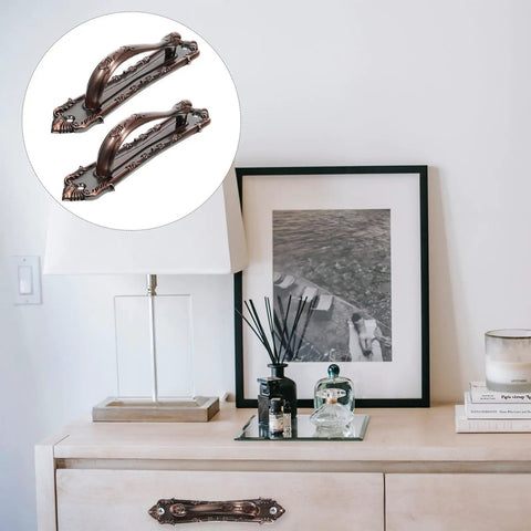 Two Pack Antique Zinc Alloy Door Handles Thickened 138mm Vintage Style Pulls For Wooden Doors And Cabinet Use With Old School Rustic Hardware For Home Renovations And Screen Door Replacement shown installed on a wooden cabinet.