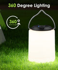 Powerful 1000LM LED Camping Lantern with Rechargeable Battery emitting 360-degree warm light on grass at night