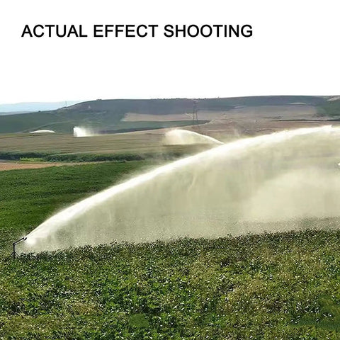 Impact Sprinkler With Pressure Gauge, 360 Degree Slow Rotation, spraying water over farmland, wide coverage visible