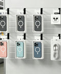 24 Pack Slatwall Hooks With Built In Price Tag Holder, Heavy Duty Metal Slatwall Accessories displaying phone cases in retail store