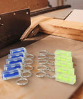 Green and Blue for acrylic Square for spirit Level Bubble Inclinometer keychains on a workbench, compact and precise.