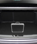 Slick Aluminum Alloy Toolbox Briefcase With Heavy Duty Hard Shell Design inside a car trunk, showcasing its portable storage for tools.