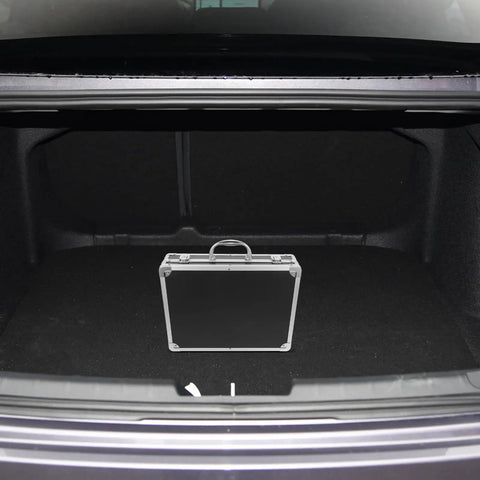 Slick Aluminum Alloy Toolbox Briefcase With Heavy Duty Hard Shell Design inside a car trunk, showcasing its portable storage for tools.