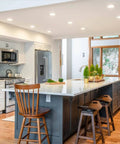 Modern kitchen with 6 Inch White Recessed Light Trim With Detachable Ring And Step Baffle illuminating wooden island and seating area