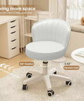 Small Round Rolling Desk Chair Armless Design Comfy PU Leather Seat Height Adjustable Swivel Office Chair in room setting