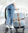 Cool Industrial Clock Gears Steampunk Print Luggage Strap With Adjustable Buckle For 20 To 32 Inch Suitcases securing a suitcase.