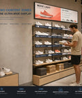 Huge 43 Inch Ultra Wide Digital Signage Display For Retail Shelves Flawlessly Combines Killer Clarity With Hella Bright 700 Nit Output And Dead Simple Plug And Play Shelf Setup For Your Store showing shoes on shelves.