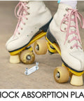 Close-up of roller skates with pink laces and a shock absorption plate from the Four Piece Roller Skate Repair Parts Kit With Five Metal Plates And Mounting Hardware For Recreational Quad Skating Shock Cushion Set 20mm Fits Most Setups For All Skill Levels.