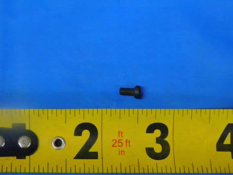 Hella Durable Indexable Insert Retaining Screw For CNC Milling And Turning Tools positioned next to a measuring tape on a blue background.