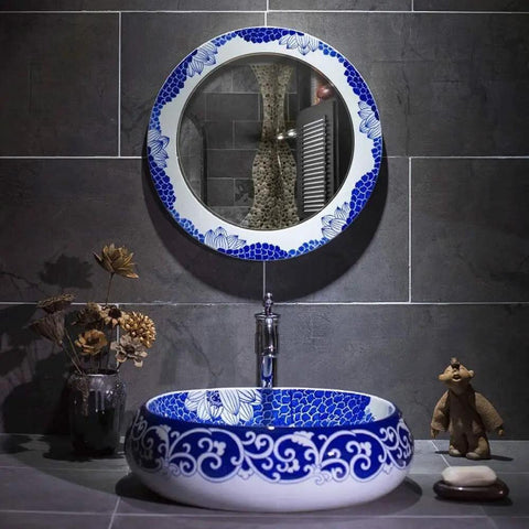 Slick Oval Vessel Sink For Bathroom Vanity Top Notch Premium Porcelain Countertop Wash Basin Featuring Hand Painted Lotus Bird Motif And Smooth High Gloss Finish in elegant bathroom setting.