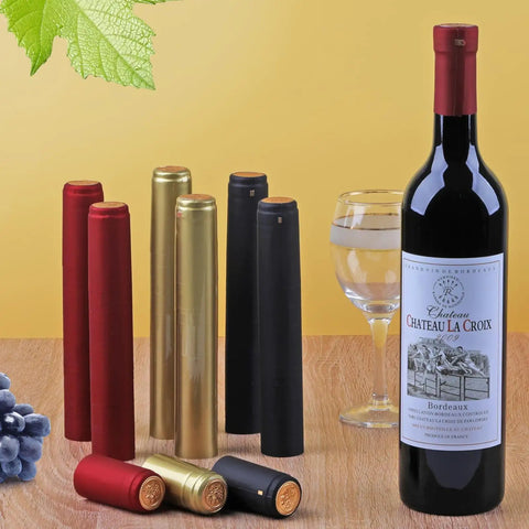 Premium Pvc Heat Shrink Wine Bottle Caps 120 Pieces Assorted Pack Heavy Duty Seal Wraps For Liquor And Craft Brewing, assorted caps near wine bottle.