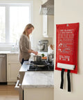Heavy Duty Fiberglass Emergency Fire Blanket in red case, ready for kitchen grease fire safety use, hung on wall.