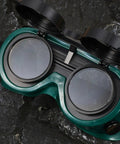 Four Pack Welding Safety Goggles With Flip Up Design kickass arc light protection showing dark green flip lenses for industrial work.
