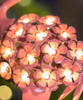Close-up of pink floral detail on Flamingo Solar Garden Lights 27 LED Warm White Outdoor Stake Light Waterproof For Lawn Patio Courtyard