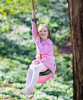 Child swinging on Outdoor Climbing Rope With Platform And Disc Swing Seat Set for Trees and Backyards, attached to tree