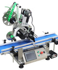 Big Time Automatic Desktop Conveyor Labeler For Flat Bottles And Merchandise Plug And Play Sticker Applicator with blue conveyor belt.