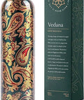 Copper Water Bottle 1 Liter With Ayurvedic Health Benefits, Leakproof Copper Vessel next to its decorative packaging