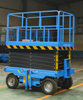 Tough Job Heavy Duty Electric Scissor Lift Platform featuring smooth hydraulic power and self powered rough terrain chassis for stress free warehouse grinds, blue with safety barrier.