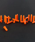 Premium Pro Grade Polymer 22LR Snap Caps For Dry Fire Training Tactical Drills And Safe Gun Handling on black surface